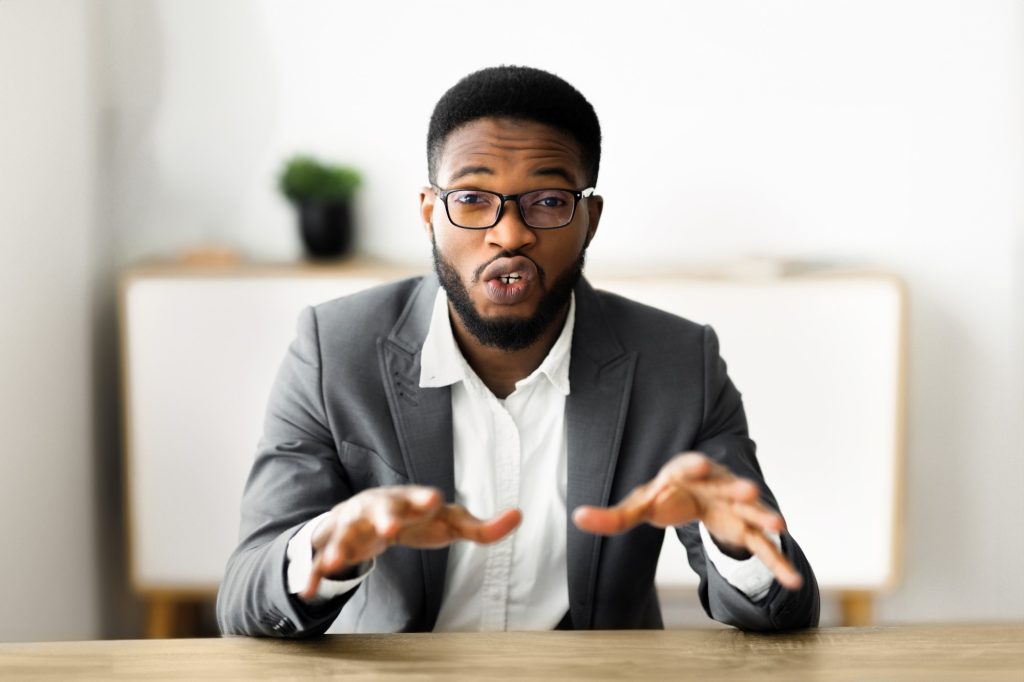 Young black businessman explaining ideas